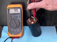 Figure 9-14. Testing a capacitor with a digital capacitor tester.